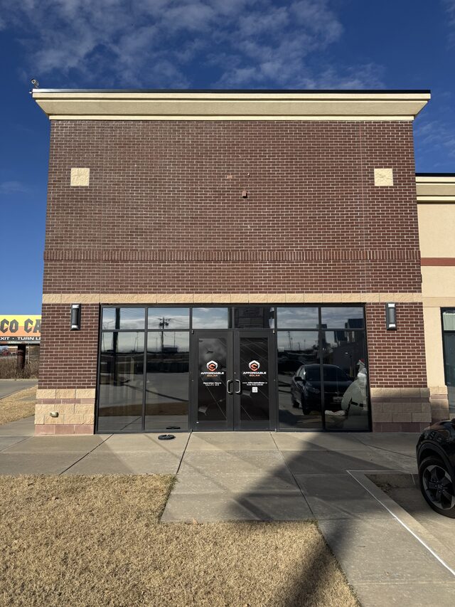 Affordable Solar storefront in Norman Oklahoma with branded front doors