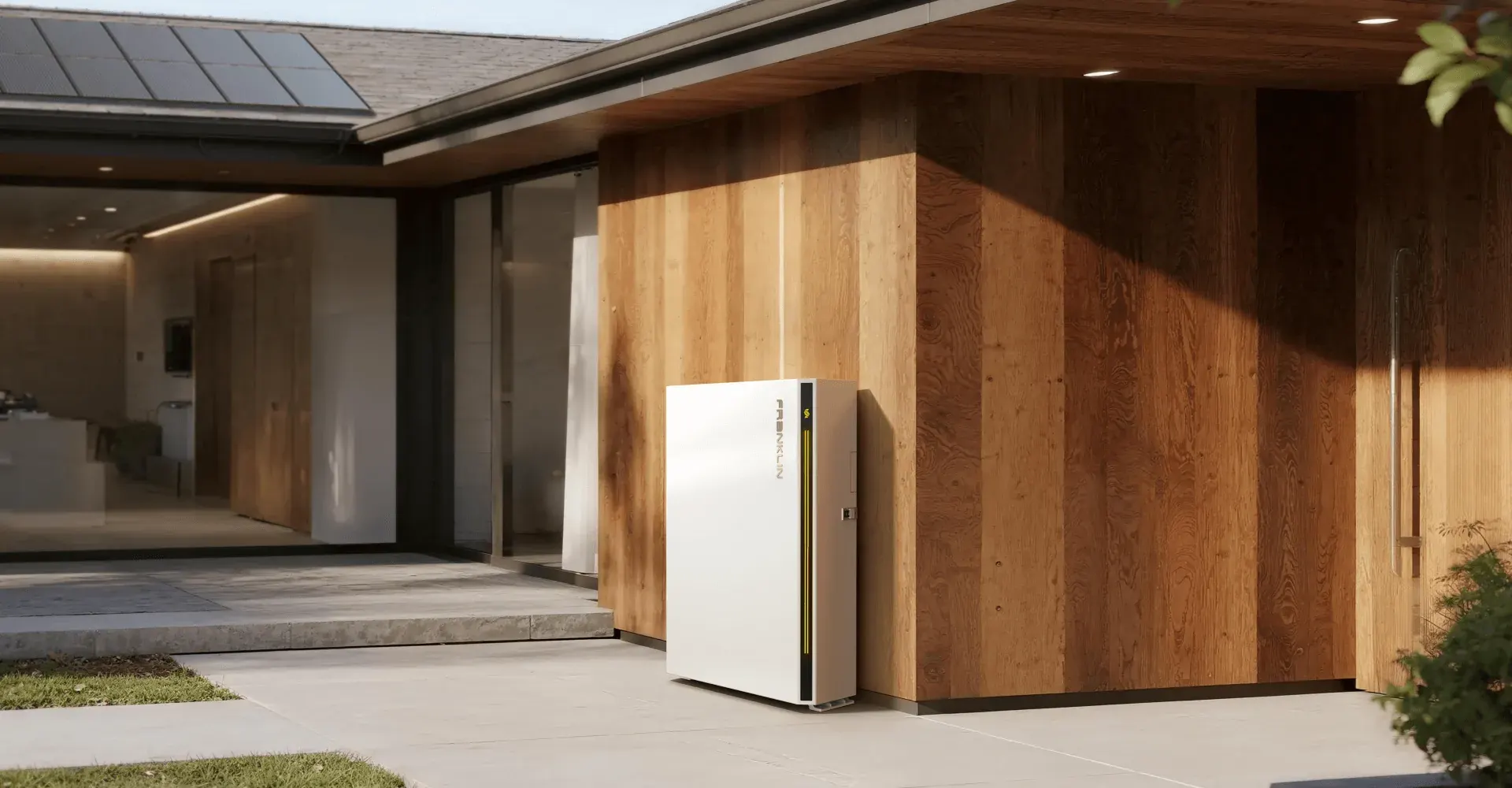 FranklinWH aPower S home battery beside a house with rooftop solar panels