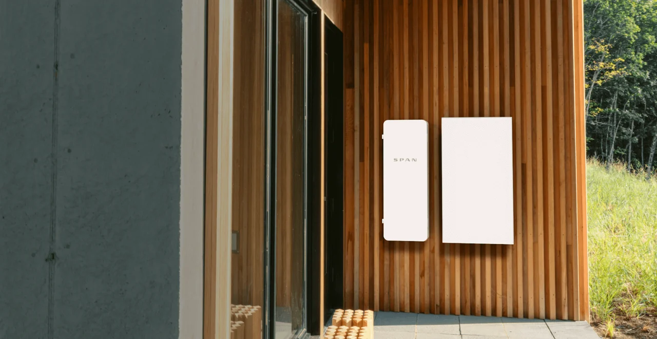 SPAN smart panel installed on modern wood-clad home exterior